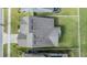 An aerial view of the house showing the roof, the lawn, and the surrounding neighborhood at 11938 Bahia Valley Dr, Riverview, FL 33579