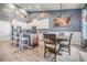 Bright dining area connected to the kitchen with a modern light fixture and ample seating at 11938 Bahia Valley Dr, Riverview, FL 33579