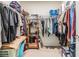 Organized walk-in closet with shelving and hanging space for ample storage at 11938 Bahia Valley Dr, Riverview, FL 33579