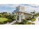 Modern community clubhouse featuring a stone facade, contemporary design, landscaping, and Windwater Club signage at 12316 49Th E St, Parrish, FL 34219