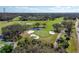 Scenic aerial of the golf course, featuring lush greens, sand traps, and a tranquil water feature at 129 W Cypress Ct, Oldsmar, FL 34677