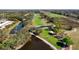 Picturesque overhead view of the golf course, highlighting ponds, lush fairways, and tree-lined paths at 129 W Cypress Ct, Oldsmar, FL 34677