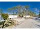 Gated entrance with decorative landscaping enhances this property's curb appeal and privacy at 13215 Seminole Trl, Wimauma, FL 33598