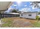 Expansive backyard featuring a screened-in pool and detached structure, perfect for outdoor living at 13508 Greenleaf Dr, Tampa, FL 33613