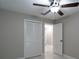 Bright bedroom with a ceiling fan, closet, and stylish flooring creates a welcoming and comfortable atmosphere at 13508 Greenleaf Dr, Tampa, FL 33613