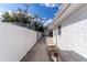 The side of the house shows a pathway, white fence, and the building exterior at 13508 Greenleaf Dr, Tampa, FL 33613