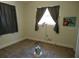 Simple bedroom features one window, carpeted floor, and neutral paint at 1372 S Hillcrest Ave, Clearwater, FL 33756