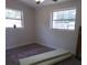 Bright bedroom featuring two large windows and neutral walls at 1372 S Hillcrest Ave, Clearwater, FL 33756