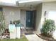 Inviting front entryway featuring a green front door, sidelight, and front garden at 1372 S Hillcrest Ave, Clearwater, FL 33756