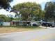 View of the home's front exterior and front yard from the street at 1372 S Hillcrest Ave, Clearwater, FL 33756