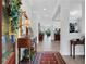 Inviting home foyer featuring a hardwood floor, decorative table, and views into the living area at 14005 Kingfisher Glen Dr, Lithia, FL 33547