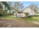 Spacious backyard featuring an inground pool and partially covered outdoor living spaces at 14803 Tulip Dr, Tampa, FL 33613