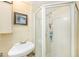 Compact bathroom featuring a corner shower and modern sink at 14803 Tulip Dr, Tampa, FL 33613