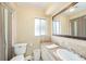 Bright bathroom featuring neutral paint, nice fixtures and a large vanity mirror at 14803 Tulip Dr, Tampa, FL 33613