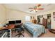 Comfortable bedroom featuring a desk area and ample closet space at 14803 Tulip Dr, Tampa, FL 33613