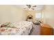 Cozy bedroom with floral bedding and charming rocking horse at 14803 Tulip Dr, Tampa, FL 33613