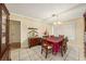 Formal dining room with tile floors, large window, and a dining table for Gathering gatherings at 14803 Tulip Dr, Tampa, FL 33613