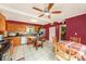 Bright kitchen and dining area with a spacious island and tile flooring at 14803 Tulip Dr, Tampa, FL 33613