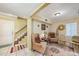 Cozy living room with tile floors, comfortable seating, and a decorative cabinet for storage at 14803 Tulip Dr, Tampa, FL 33613