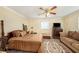 Elegant main bedroom featuring a four-poster bed and ample natural light at 14803 Tulip Dr, Tampa, FL 33613