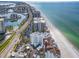 Expansive aerial view of beachfront condos with stunning ocean views and a coastal highway at 1590 Gulf Blvd # 501, Clearwater Beach, FL 33767