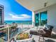 Relaxing balcony view with seating area overlooking the ocean at 1590 Gulf Blvd # 501, Clearwater Beach, FL 33767