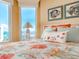 Bright bedroom features large windows with water views, neutral walls, and stylish decor at 1590 Gulf Blvd # 501, Clearwater Beach, FL 33767