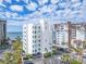 Beautiful building exterior view of the condo with beach and palm trees at 1590 Gulf Blvd # 501, Clearwater Beach, FL 33767