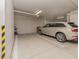 Modern residential garage with an SUV parked in a designated spot at 1590 Gulf Blvd # 501, Clearwater Beach, FL 33767