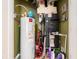 Utility closet with water heater, HVAC, cleaning supplies, and home appliances at 1590 Gulf Blvd # 501, Clearwater Beach, FL 33767