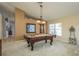 A recreation room featuring a pool table, creating an excellent space for leisure activities at 1788 Biarritz Cir, Tarpon Springs, FL 34689