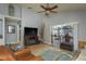 Spacious living room with high ceilings, a ceiling fan, and sliding glass doors leading to the outdoor patio at 1788 Biarritz Cir, Tarpon Springs, FL 34689