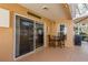 Inviting outdoor patio area with sliding door access to the home's interior and comfortable seating at 1788 Biarritz Cir, Tarpon Springs, FL 34689