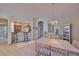 Bright dining room features a chandelier, views into the kitchen, and transitions into other living areas at 1912 Acadia Greens Dr, Sun City Center, FL 33573