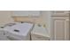 Laundry room featuring new appliances, cabinets, and a utility sink at 1912 Acadia Greens Dr, Sun City Center, FL 33573