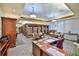 Well-stocked library with bookshelves, tables, and chairs, creating a comfortable reading environment at 1912 Acadia Greens Dr, Sun City Center, FL 33573