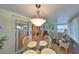 Light-filled sunroom featuring a glass-top table and comfortable seating with views of the outdoors at 1912 Acadia Greens Dr, Sun City Center, FL 33573