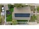 Aerial view of the property highlighting the backyard, solar panels, and perimeter fence at 1924 W Carmen St, Tampa, FL 33606