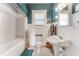 Bathroom featuring white subway tile, pedestal sink, and mosaic tile flooring at 1924 W Carmen St, Tampa, FL 33606