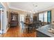 Dining room featuring hardwood floors, a large dining table, and natural light from nearby windows at 1924 W Carmen St, Tampa, FL 33606