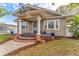 Quaint single-Gathering home with a classic porch, columns, and a beautiful tan exterior at 1924 W Carmen St, Tampa, FL 33606