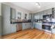 Bright kitchen features modern appliances, light blue cabinets, and stainless steel backsplash at 1924 W Carmen St, Tampa, FL 33606