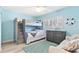 A nautical-themed ' bedroom with bunk beds, blue walls, and a cozy seating area at 2298 Americus E Blvd # 6, Clearwater, FL 33763