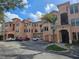 Condominium exterior elevation with a view of multiple stories, garages, and parking at 2755 Via Capri Dr # 1215, Clearwater, FL 33764