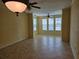 Open-concept living room with tile floors, neutral paint, and bright windows for lots of natural light at 2755 Via Capri Dr # 1215, Clearwater, FL 33764