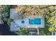 Aerial view showcasing the private pool, hot tub, deck, and surrounding landscaping at 2786 Countryside Blvd # 2, Clearwater, FL 33761