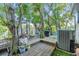 Beautiful backyard with a wooden deck and lush landscaping, perfect for outdoor living at 2786 Countryside Blvd # 2, Clearwater, FL 33761