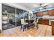 Kitchen and dining area with tile floors, sliding glass door to outdoor patio at 2786 Countryside Blvd # 2, Clearwater, FL 33761