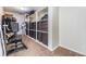 Organized walk-in closet providing ample storage with shelves and an exercise machine at 2786 Countryside Blvd # 2, Clearwater, FL 33761