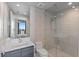 Modern bathroom with a glass shower, sleek vanity, and stylish wallpaper at 301 1St S St # 2104, St Petersburg, FL 33701